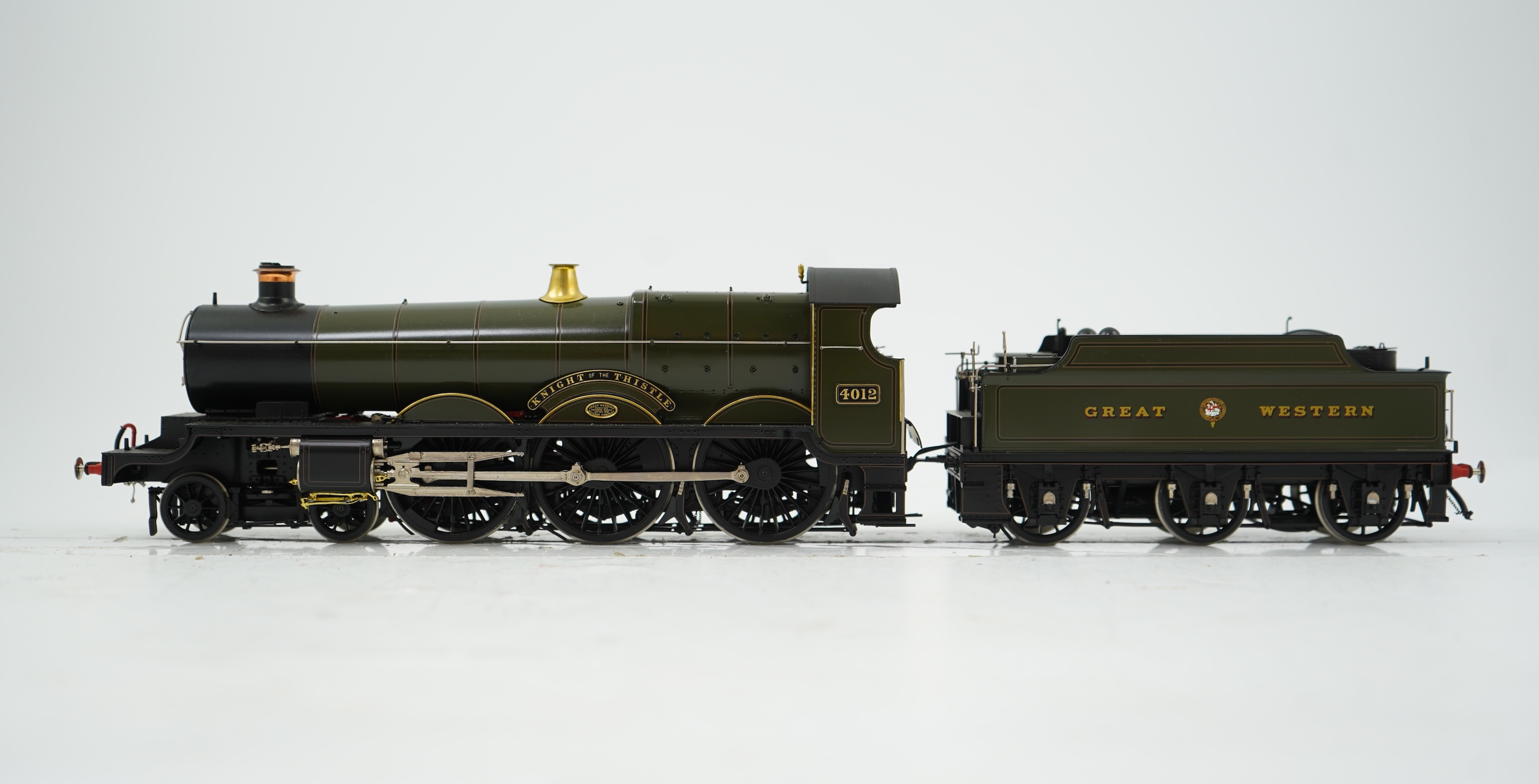 An 0 gauge Masterpiece Models model of GWR Star Class, Knight of the Thistle, 4012, 4-6-0 tender locomotive, powered for two rail operation, with original box, accessories, instruction booklet and other paperwork.